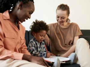 Mothers Looking at Kid Coloring Picture